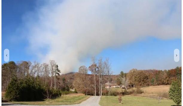 Fire Crews Battle Wildfire Threatening Homes, Businesses In Henderson County
